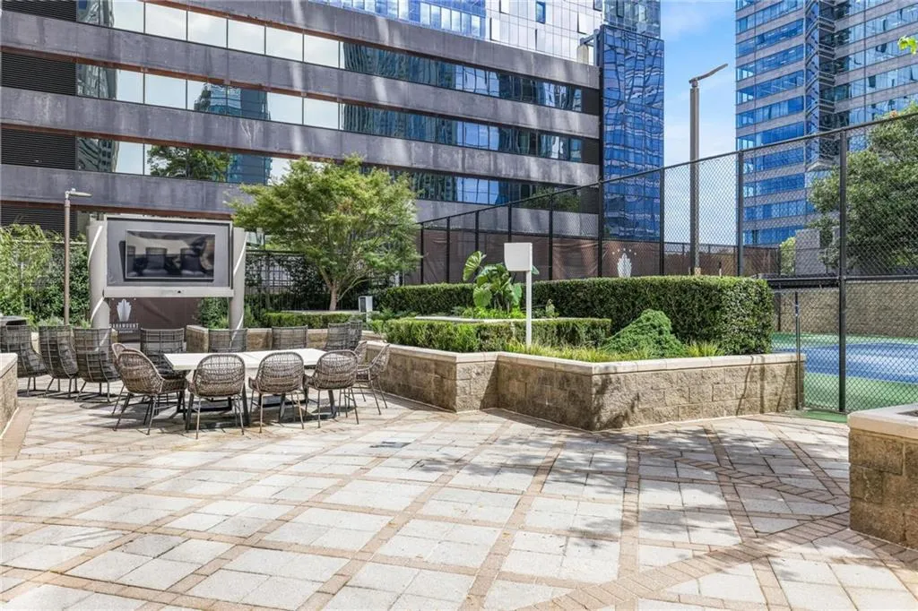 View of home's community with a city view and a patio area