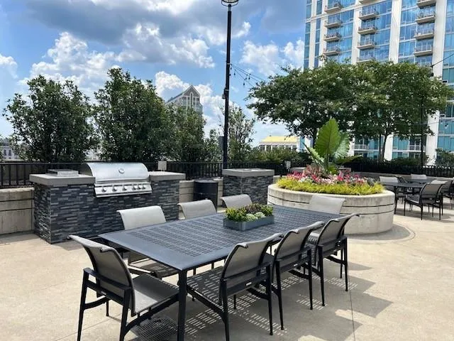View of patio featuring outdoor dining space and exterior kitchen