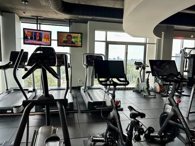 Exercise room with floor to ceiling windows