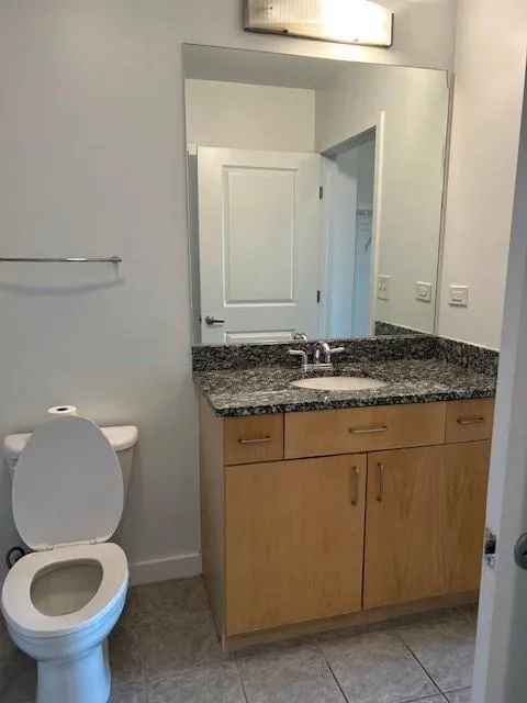 Bathroom with vanity and tile patterned flooring