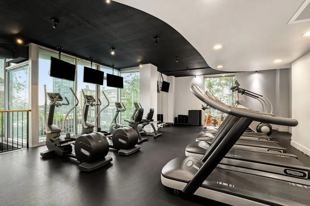 Realm Amenity - Two Story Fitness Center With Cardio Equipment And Weights
