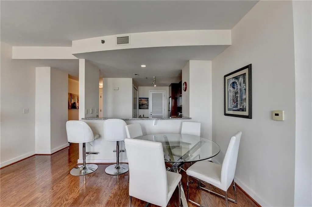 Dining area with wood-type flooring