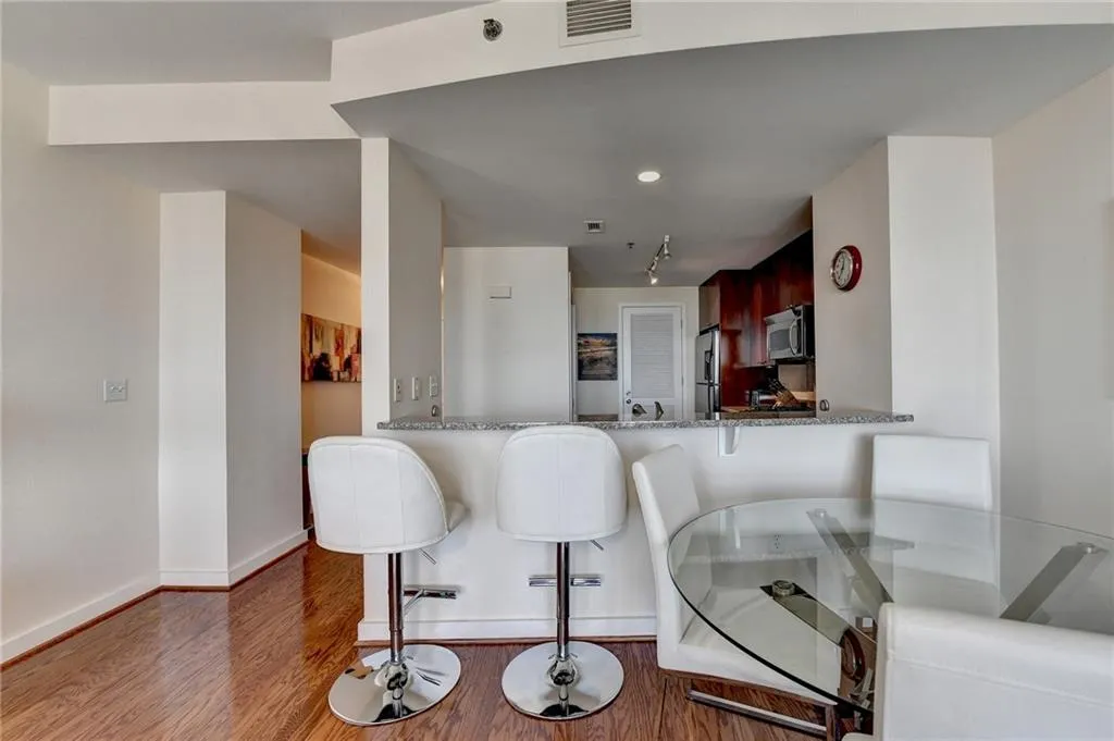 Dining space featuring dark wood-type flooring