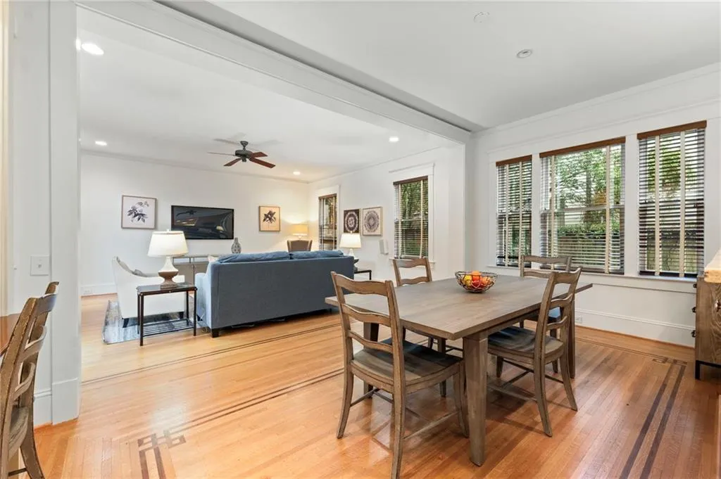 Dining area featuring light wood-type flooring, recessed lighting, ornamental molding, and a ceiling fan