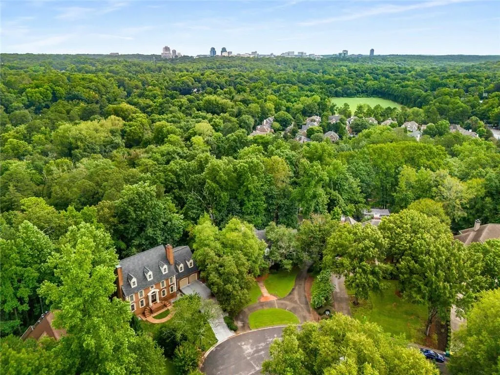 Nestled on a prime lot in the Intersection of Sandy Springs, North Buckhead, and Brookhaven, this stunning residence sits at the cul-de-sac in an exclusive 9-home enclave, with everything within reach