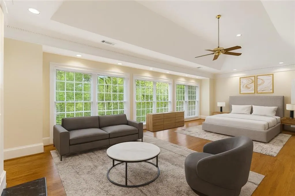 VIRTUALLY STAGED SPACIOUS PRIMARY BEDROOM WITH SITTING AREA AND FIREPLACE