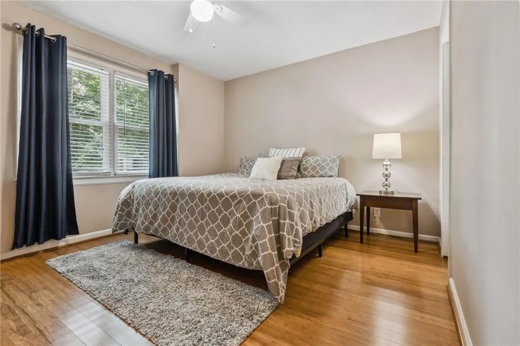 5th Bedroom on terrace level with king bed, walk in closet and ceiling fan