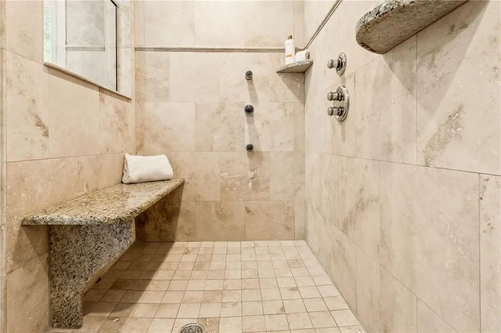 Bathroom featuring tiled shower