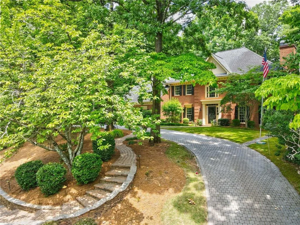 Welcome Home! View of front of home with paver driveway entrance stairs