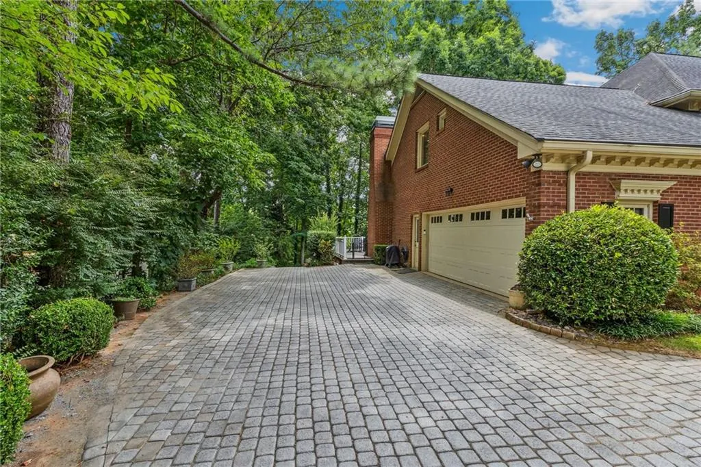 View of property exterior featuring a side garage