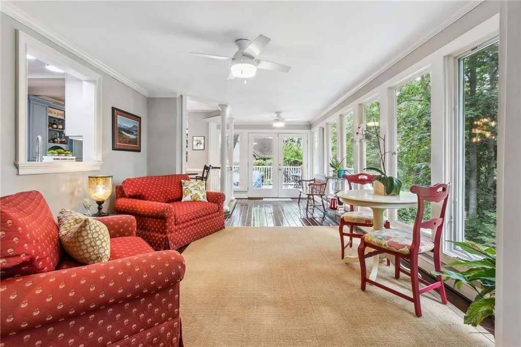 Expansive view of sunroom with wall of windows.