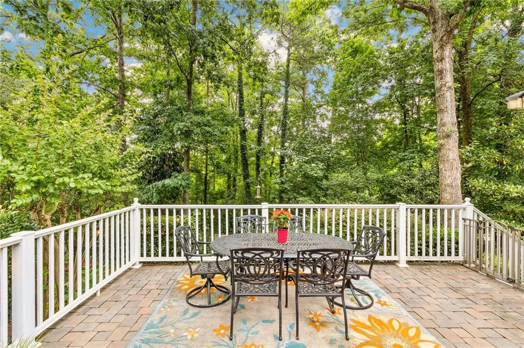 Tree scaped patio off main floor sunroom