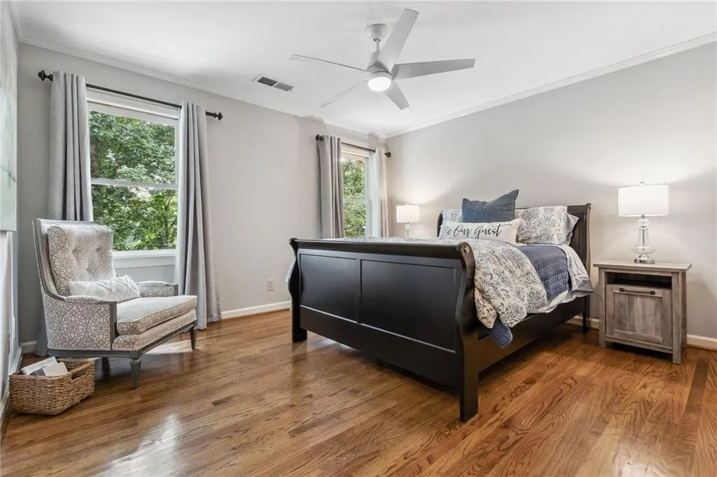 2nd upstairs ensuite bedroom with ceiling fan and closet.