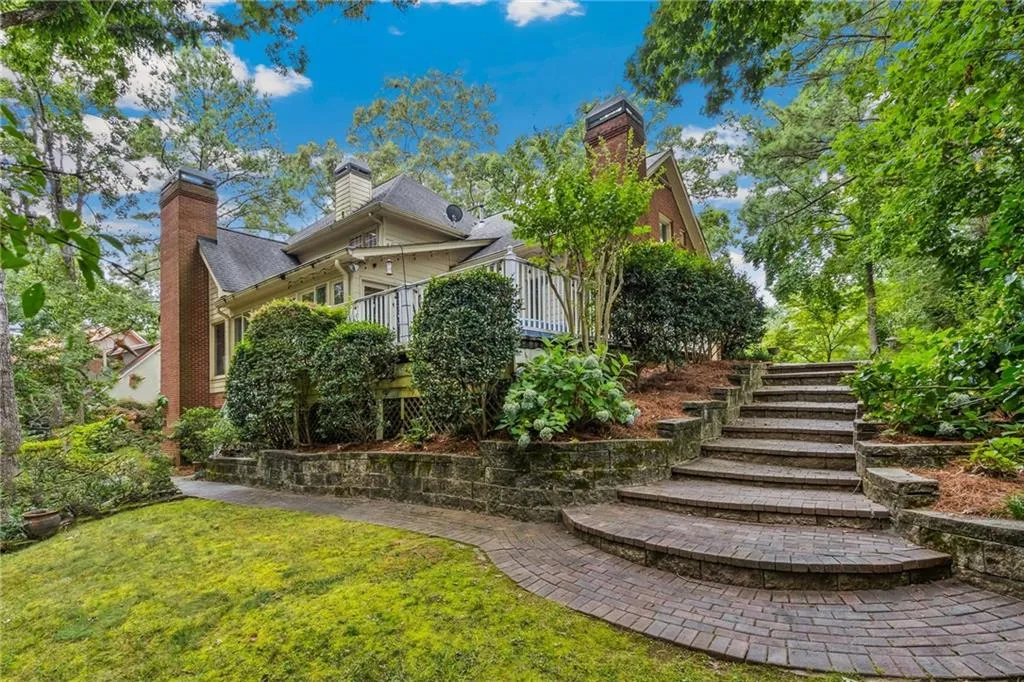 View off the patio with lush landscape and flat yard.