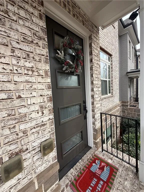 Property entrance with covered porch