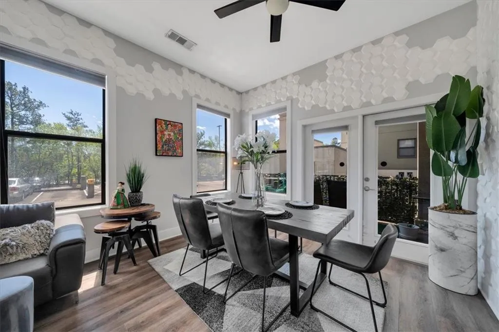 Dining area with ceiling fan and hardwood / wood-style flooring