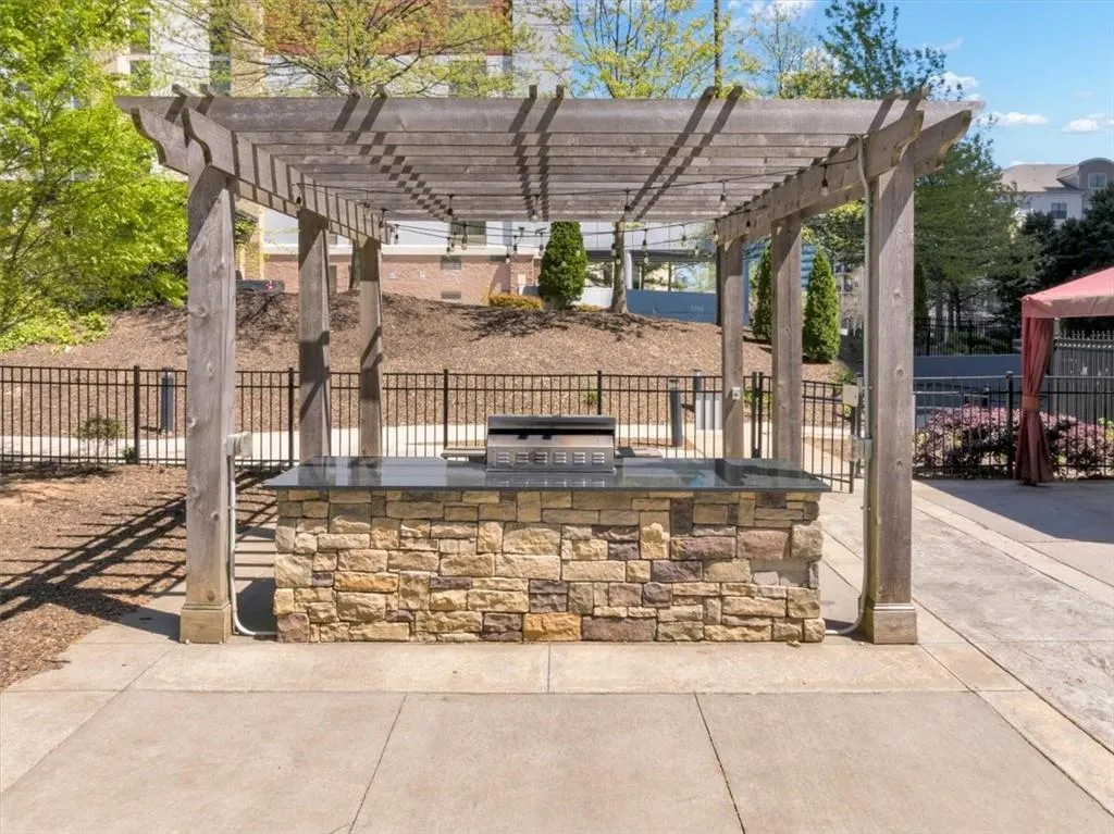 View of Grill area with a pergola.