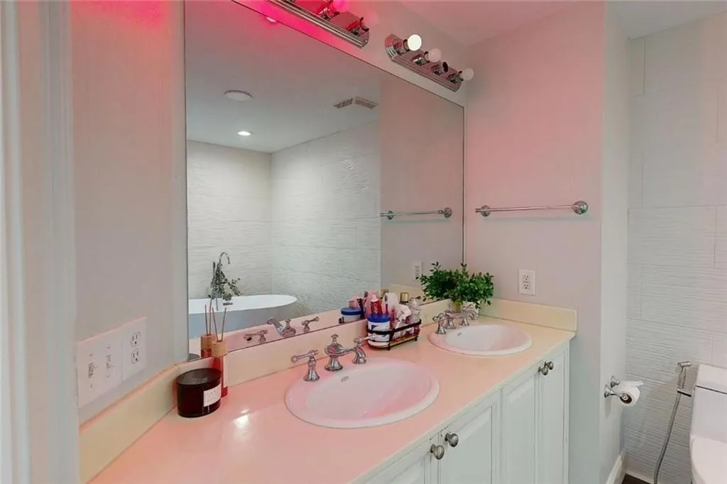 Bathroom featuring a freestanding bath and double vanity