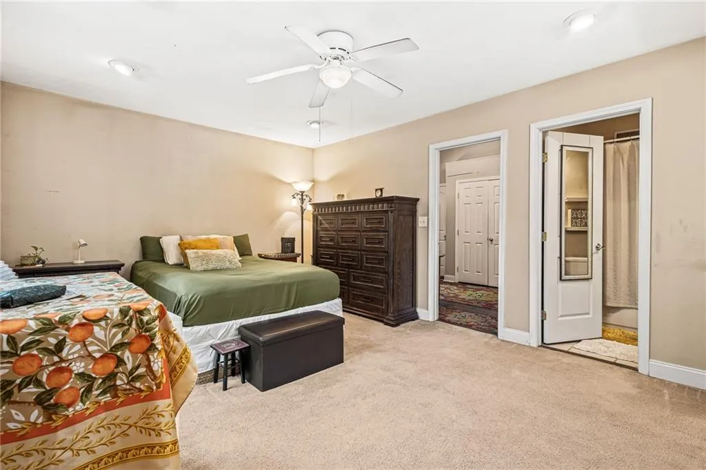 Bedroom featuring light carpet, recessed lighting, and ceiling fan