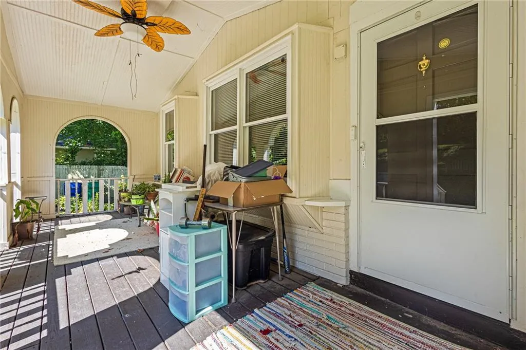 Wooden terrace with a ceiling fan