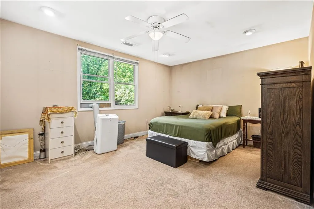 Bedroom featuring carpet and ceiling fan
