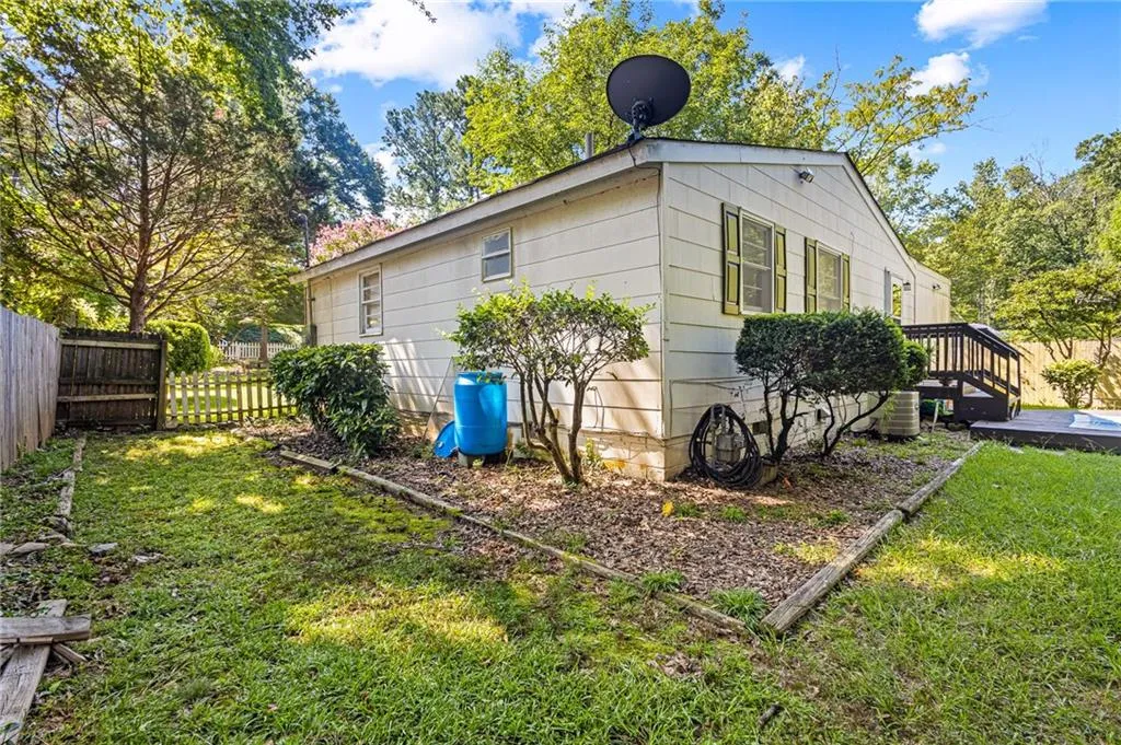 View of side of property featuring a central AC unit