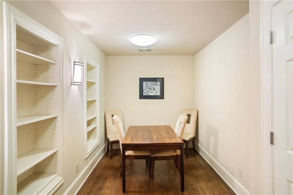 Dining room featuring dark wood-type flooring Dining room featuring dark wood-type flooring