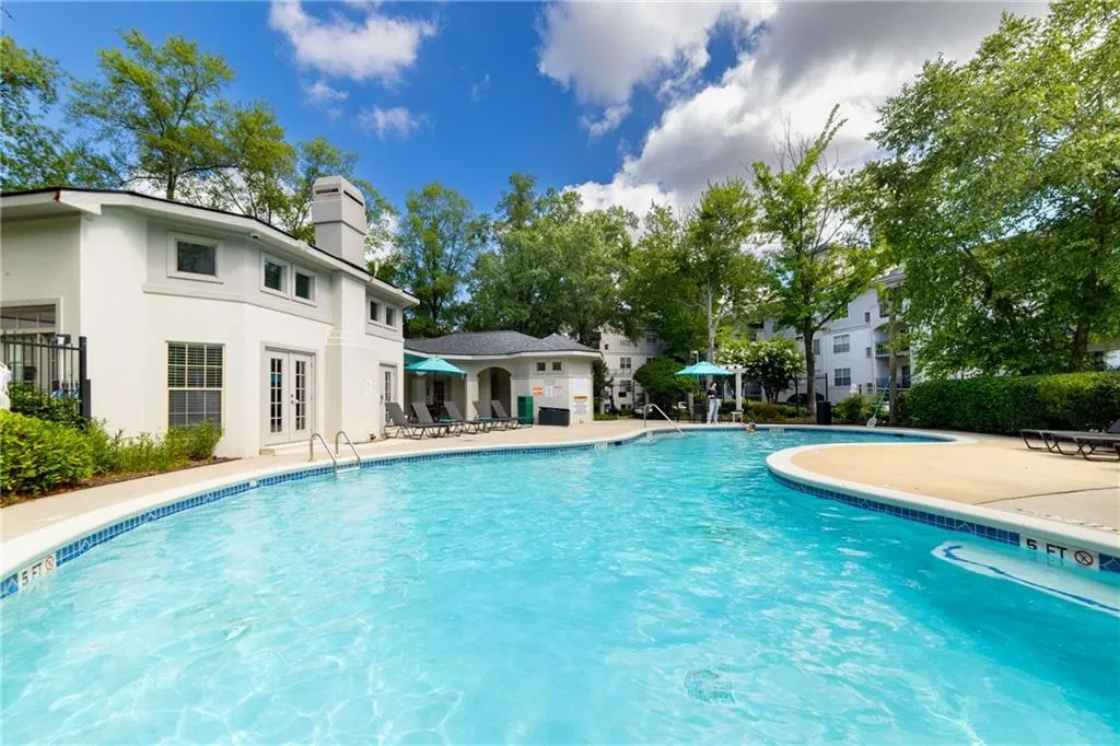 Community pool featuring a patio and french doors