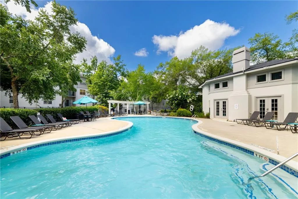 Community pool featuring a patio area and french doors