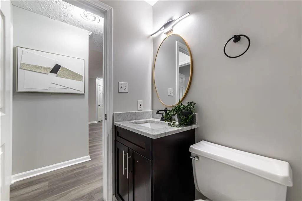 Bathroom featuring vanity and wood finished floors