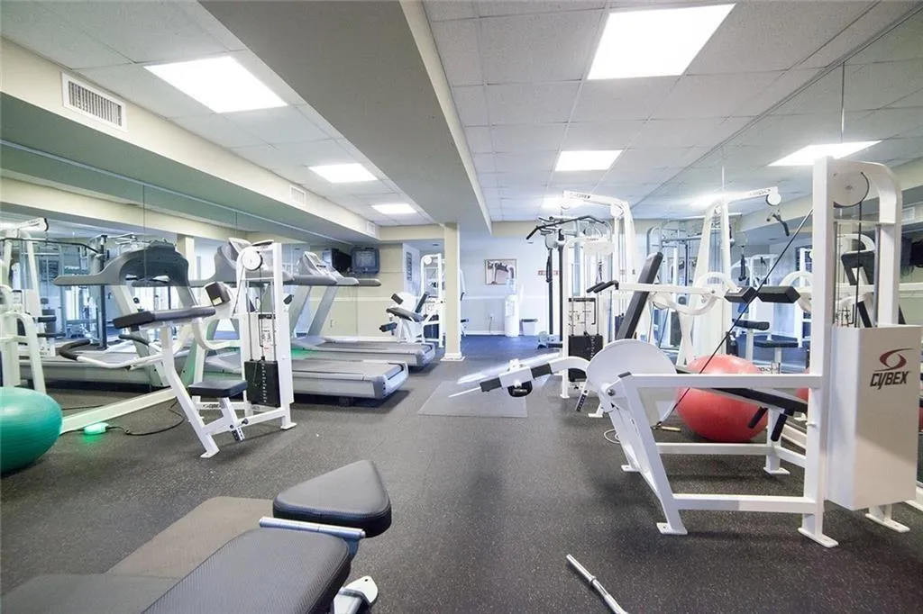 Exercise room with a paneled ceiling