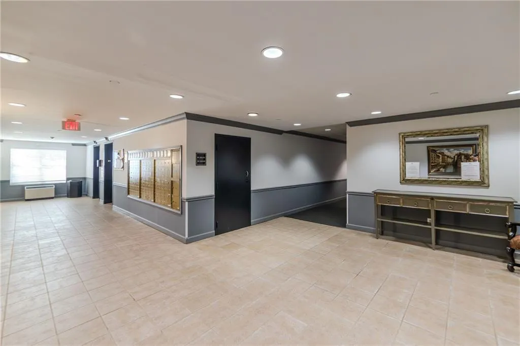 Community lobby featuring ornamental molding and recessed lighting