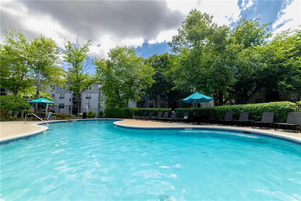 Community pool featuring a patio and a gazebo