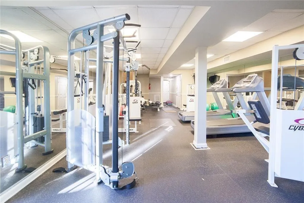 Exercise room with a paneled ceiling