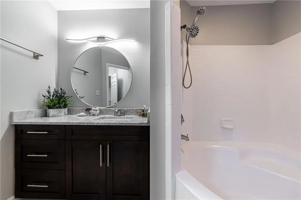 Full bathroom featuring vanity and shower / bathtub combination