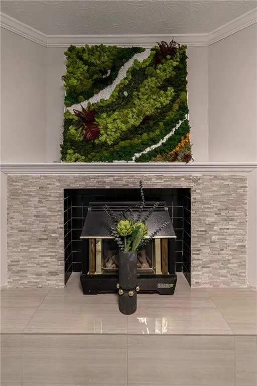 Detailed view of ornamental molding and a tile fireplace