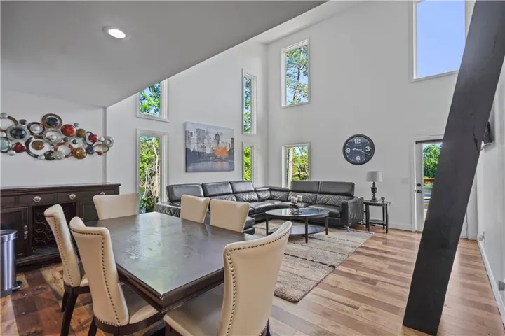 Vaulted ceilings, recessed lighting, and expansive windows