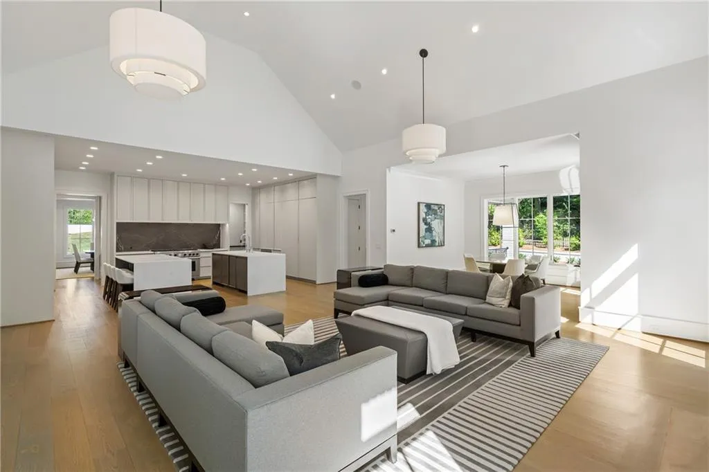 Open concept living space from kitchen to the den creates an effortless space for entertaining