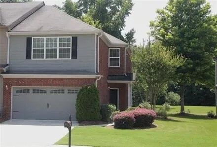Two-story exterior with brick and siding facade
