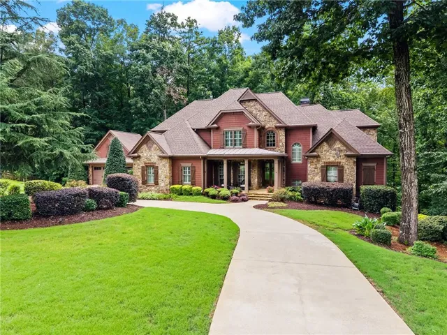 Perched at the end of a quiet cul--de-sac, the property showcases lavishly landscaped grounds and backs to US Army Corps of Engineer property, providing an eternal wooded backdrop for ultimate privacy.