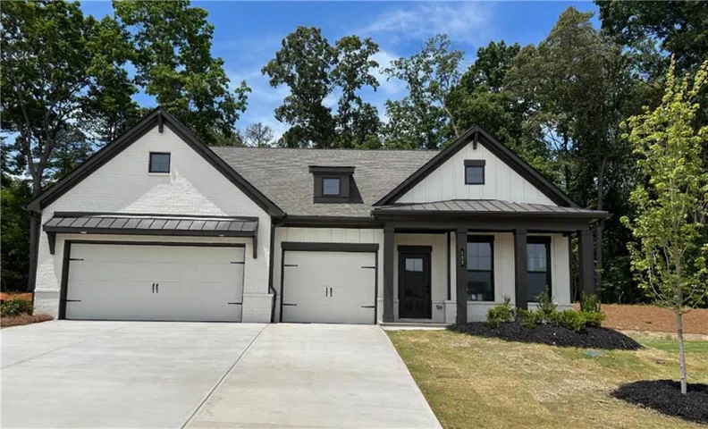Contemporary white brick exterior with dark trim accents