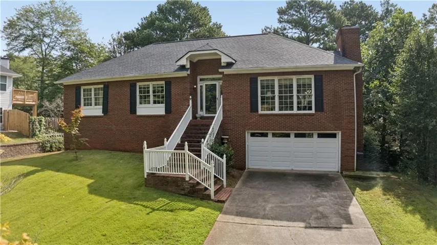 Traditional Brick Fixer with Primary Suite on Main in East Cobb’s coveted Walton High School District!
