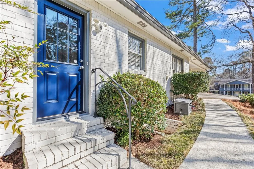 View of exterior entry with brick siding