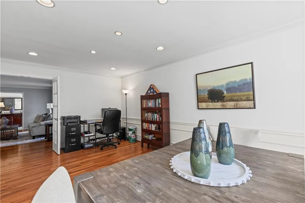 Office area with recessed lighting, wood finished floors, and crown molding