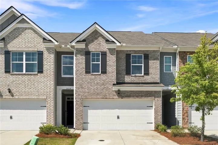 Brick and siding exterior with gabled roof lines