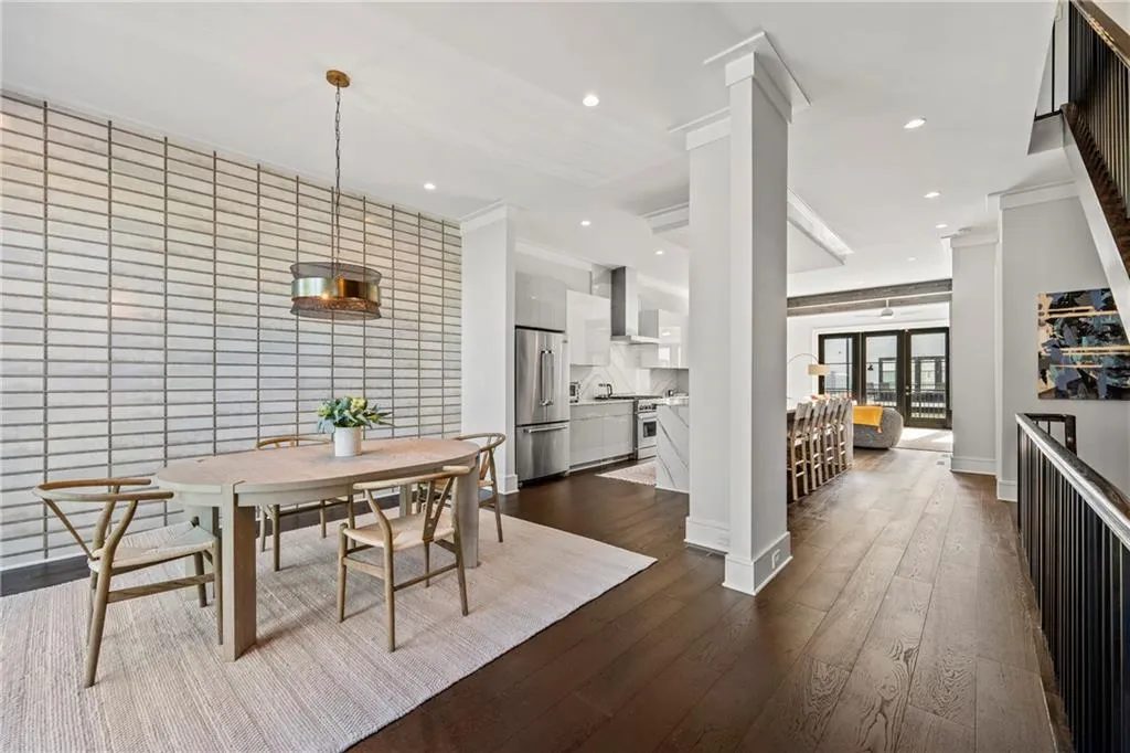 Dining room featuring dark wood-type flooring, recessed lighting, and ornamental molding