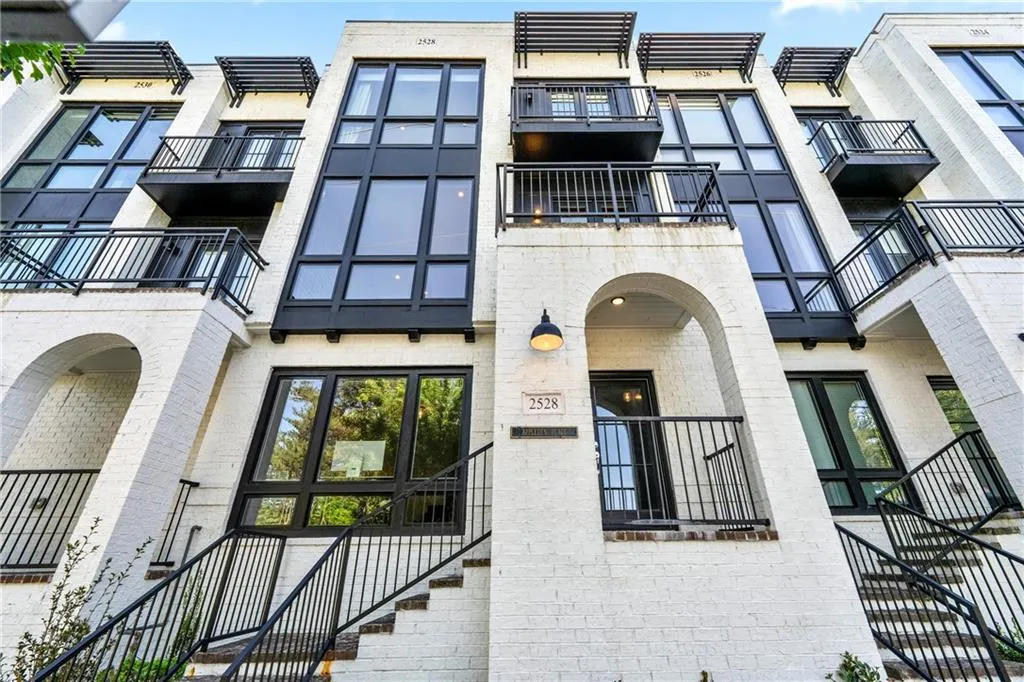 View of apartment building / complex with stairs