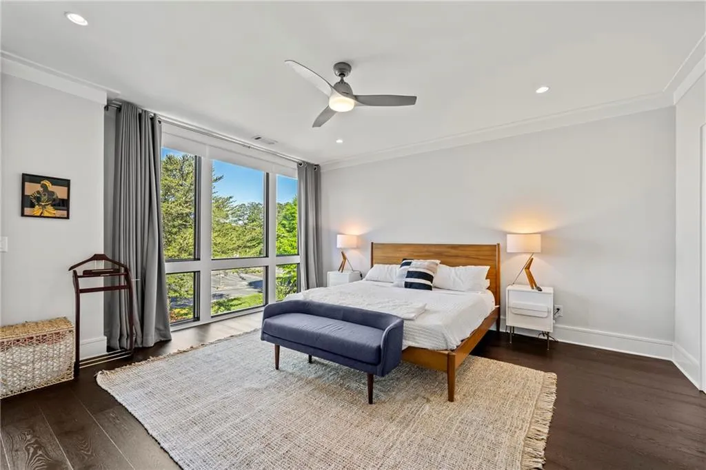Bedroom featuring dark wood-style floors, recessed lighting, a ceiling fan, and crown molding