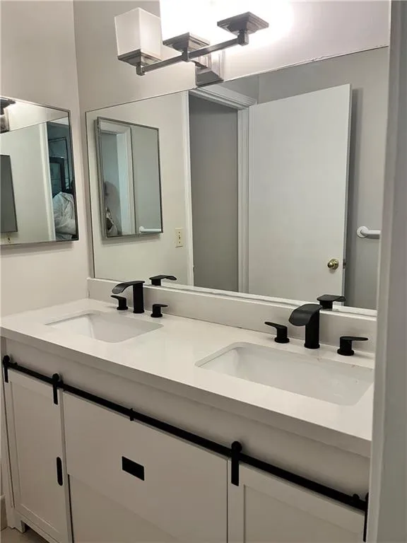 Bathroom featuring double vanity
