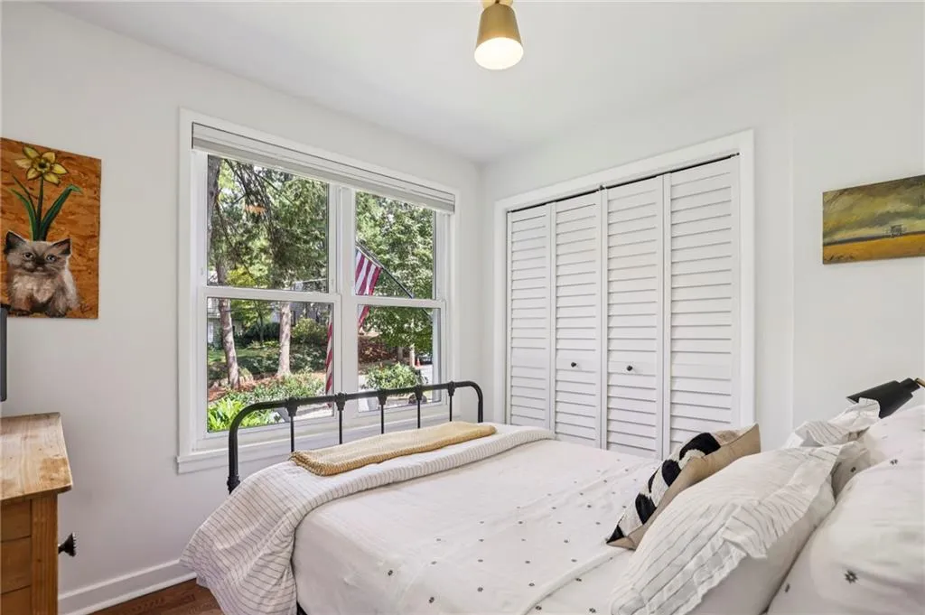 Bedroom with a closet and wood finished floors